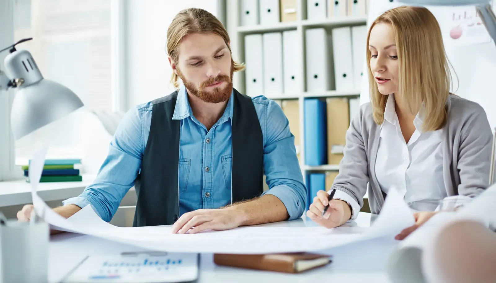 Managers analyzing their survey results
