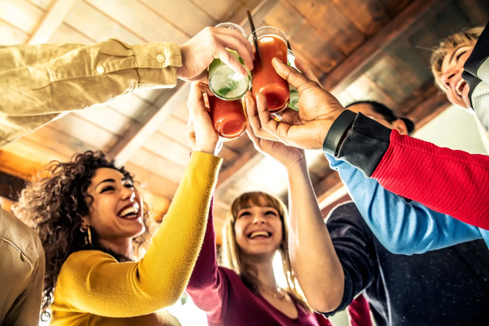 Colleagues toasting during a virtual happy hour
