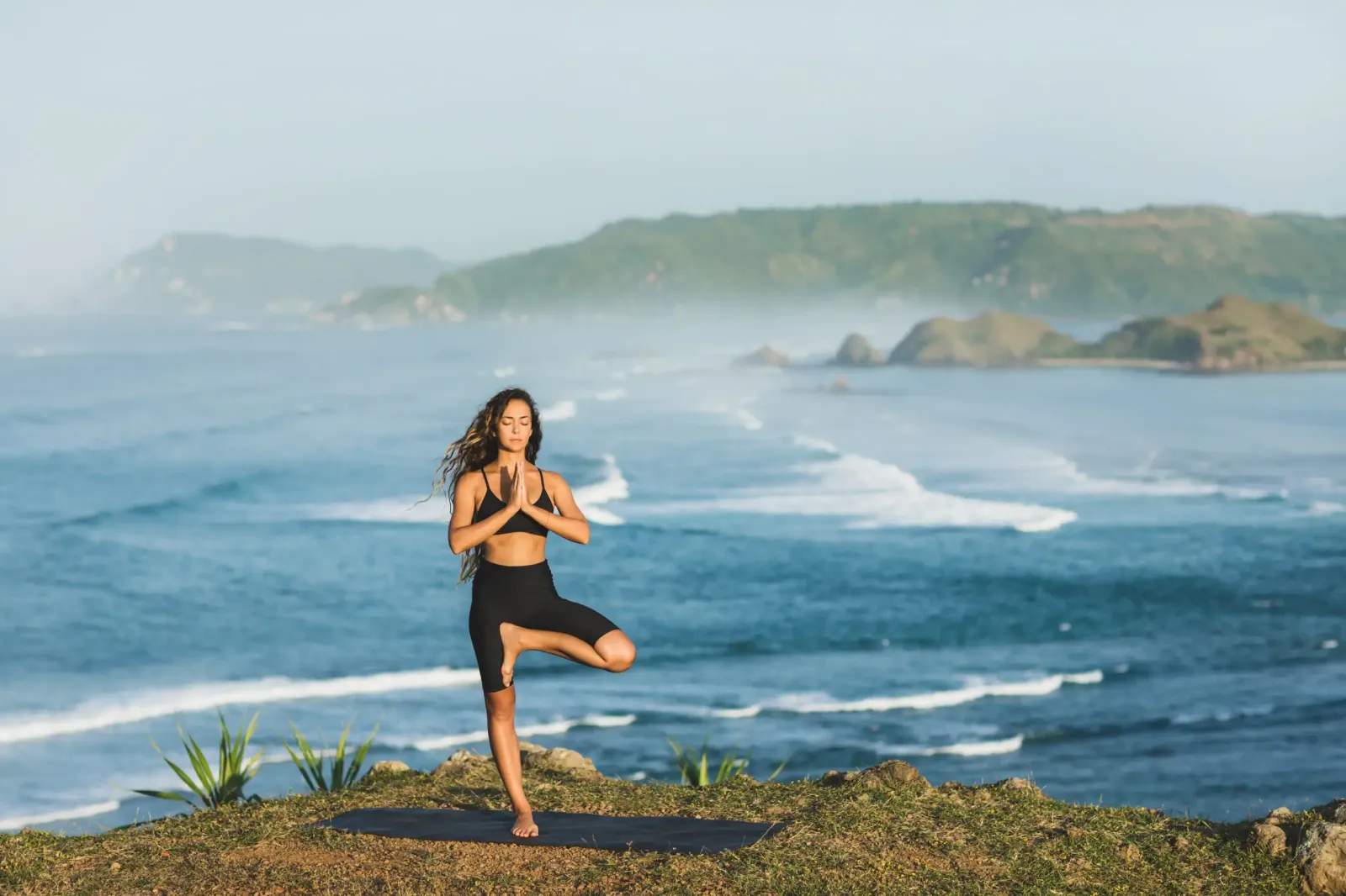 Woman practising yoga, a moment of relaxation