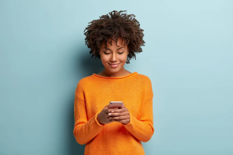 Employee answering an engagement survey on her phone