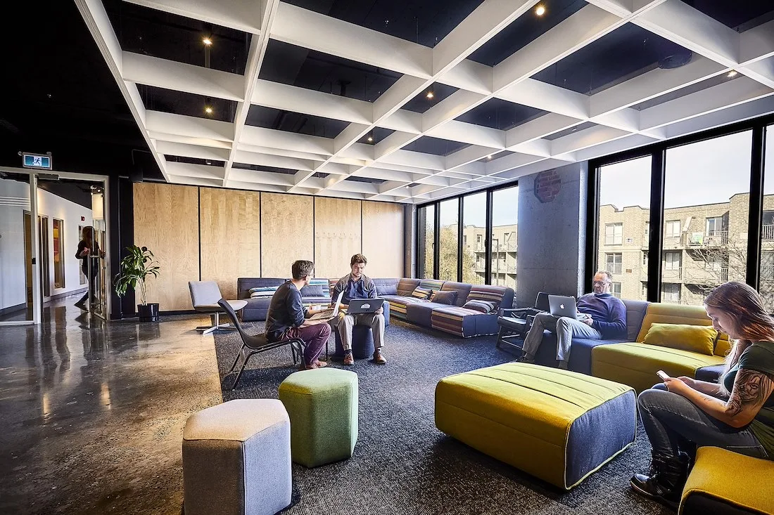 Lounge area with armchairs and large windows